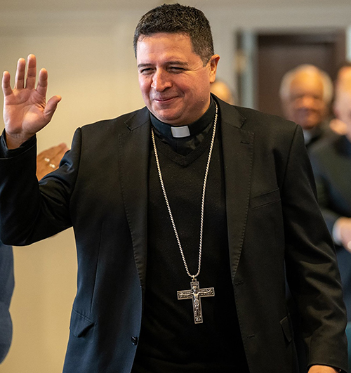 Bishop Evelio Menjivar-Ayala, auxiliary bishop for the Archdiocese of Washington greets a crowd at the Archdiocese's Pastoral Center in Hyattsville, Maryland, in this file photo from Dec. 19, 2022. (OSV News photo/Mihoko Owada, Catholic Standard)
