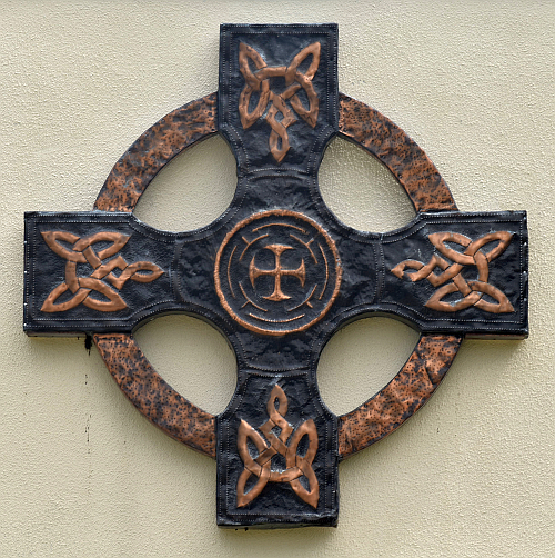 Irish-style cross stands on a wall at Our Lady of Mercy Church in Deerfield Beach.