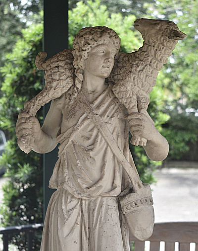 Statue of David as a young shepherd carries a lamb in a gazebo outside Our Lady of Mercy Church in Deerfield Beach.