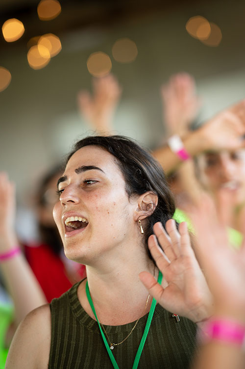 A young adult sings at a Mass Aug. 6 concluding a weeklong series of parallel World Youth Day 2023 events to mirror those underway in Lisbon, Portugal. Many here were unable to travel to Lisbon. Miami Archbishop Thomas Wenski celebrated the Mass at the Land of the Pierced Hearts retreat center in Homestead.