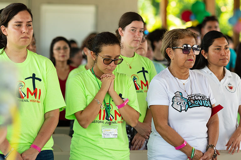 Miami young adults pray Aug. 6 at the closing Mass of World Youth Day Miami in the Land of the Pierced Hearts in Homestead. The Mass concluded a weeklong series of parallel World Youth Day 2023 events to mirror those underway in Lisbon, Portugal, for the many here who were unable to travel to Lisbon.