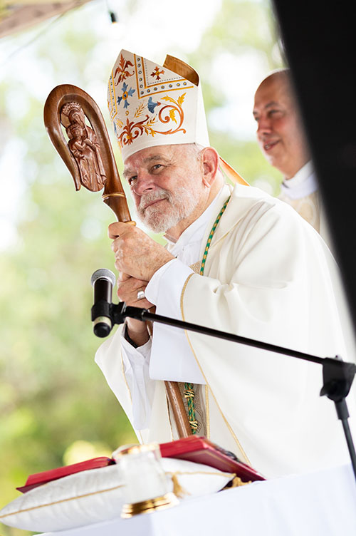 Archbishop Thomas Wenski celebrates Mass Aug. 6, 2023, at the Land of the Pierced Hearts retreat center in Homestead, for some 200 youth and young adults who attended a weeklong series of parallel World Youth Day 2023 events to mirror those underway in Lisbon, Portugal. Many here were unable to travel to Lisbon.