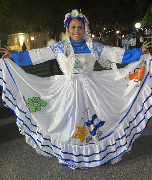 Escarleth Membreno shows her traditional Nicaraguan dress for the celebration of the Gritería Chiquita (small shouting), on the feast of the Assumption, Aug. 15, 2023, at St. John the Apostle Church, Hialeah.