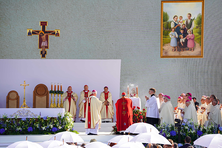 Cardinal Marcello Semeraro, prefect of the Dicastery for the Causes of Saints, uses incense to bless the relics of Józef and Wiktoria Ulma and their seven children, during their beatification Mass Sept. 10, 2023, in Markowa, Poland. Pope Francis prayed the family, killed for hiding Jews during World War II, would be an example to all Christians of goodness and service to those in need. (CNS photo/Justyna Galant)