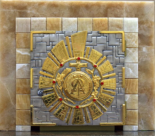 The front of the tabernacle in the chapel of San Isidro Church in Pompano Beach shows embossed metallic wheat and grapes, the elements of the Eucharist.