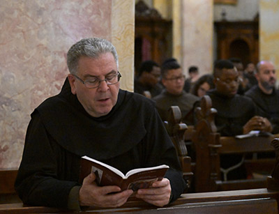 Franciscan Father Francesco Patton, custos of the Holy Land, prays in St. Saviour Monastery on the day of prayers and fasting for peace in the Old City of Jerusalem, Oct.17, 2023. That day a massive blast rocked CNEWA-supported al-Ahli Arab Hospital in Gaza City packed with wounded and other Palestinians seeking shelter, killing hundreds of people, the Hamas-run Gaza Health Ministry said. (OSV News photo/Debbie Hill)