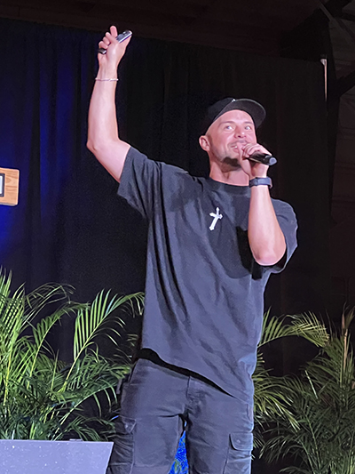 Joe Melendrez, a Catholic speaker and recording artist, speaks at the Rise Up event for Catholic high schoolers at the St. Thomas University Fernandez Family Center, Oct. 5, 2023.