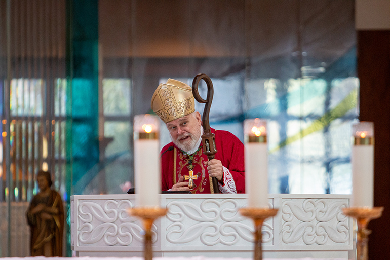 Archbishop Thomas Wenski preaches the homily to nearly 1,200 religious education volunteers and Catholic school teachers gathered for the annual Catechetical Day, Oct. 28, 2023, at Archbishop McCarthy High in Southwest Ranches. The archbishop celebrated the day's opening Mass next door at St. Mark Church.
