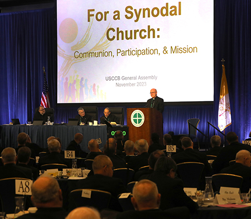 Bishop Kevin C. Rhoades of Fort Wayne-South Bend, Ind., speaks during a conversation about the Synod on Synodality in Rome at a Nov. 14, 2023, session of the fall general assembly of the U.S. Conference of Catholic Bishops in Baltimore. Also pictured are Father Michael J.K. Fuller, USCCB general secretary; Archbishop Timothy P. Broglio of the U.S. Archdiocese for the Military Services, USCCB president; and Archbishop William E. Lori of Baltimore, USCCB vice president. (OSV News photo/Bob Roller)