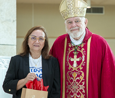 Archbishop Thomas Wenski poses with Liliana Martorella of Mother of Our Redeemer Parish in Miami, one of two recipients of this year's Esperanza Ginoris Award for "exemplifying excellence in catechetical ministry." The awards were presented at the conclusion of the opening Mass of the annual Catechetical Conference, which brought more than 1,000 religious education volunteers and Catholic school teachers to St. Mark Church and Archbishop McCarthy High School in Southwest Ranches, Oct. 28, 2023.