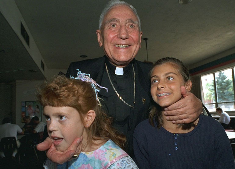 Cardinal Eduardo Pironio, who died Feb. 5, 1998, is shown with young people at World Youth Day in 1993 in Denver. Cardinal Pironio was beatified in his native Argentina Dec. 16, 2023, where he was remembered as "the prophet of hope," who worked to implement the Second Vatican Council in Latin America and became known as "the cardinal of young people." (OSV News photo/CNS file, Michael Edrington)