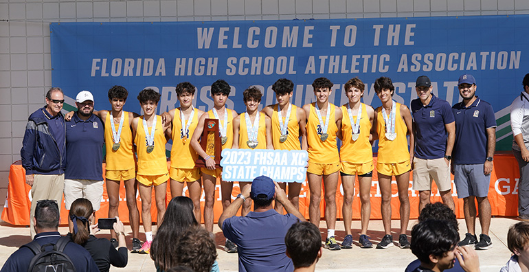 Belen Jesuit Prep's cross country runners and coaches are honored for their seventh consecutive first-place finish, and 15th overall state championship, at the conclusion of the 2023 Florida High School Athletic Association Cross Country Championships, held Nov. 17, 2023, in Tallahassee.