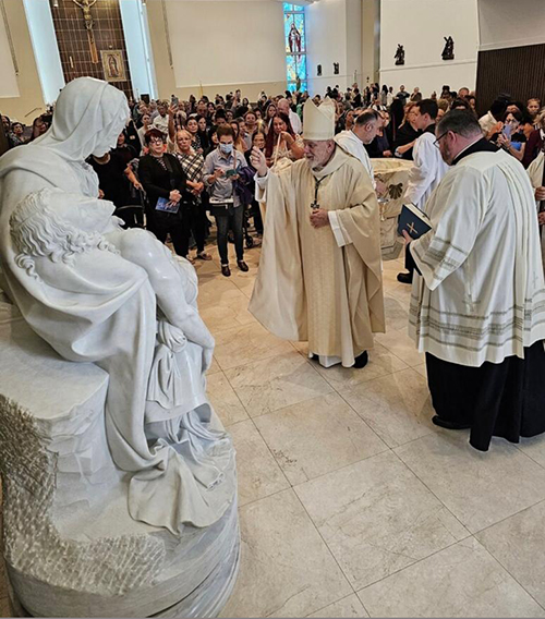 Archbishop Thomas Wenski blesses the donated replica of Michelangelo's La Pietà at the 2023 All Souls Day Mass at Our Lady of Guadalupe Church in Doral.