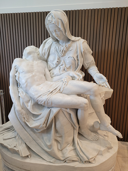 A replica of Michelangelo's La Pietà is displayed in the narthex of Our Lady of Guadalupe Church in Doral. The gift was generously donated by James L. Case, III, and Elise A. Case, in loving memory of their father, James L. Case. The copy of the priceless work of art was made by local sculptor Nilda Comas, and a team of 12 other sculptors.
