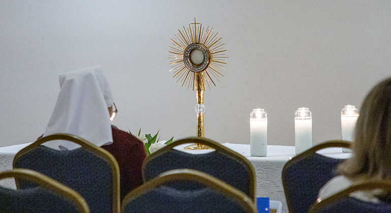Serra Club members from the U.S. and Canada spend time in adoration during their Jan. 18-21, 2024, Serra USA Rally in Miami. The monstrance, entrusted to the care of the Serra Club, is one of only six designed for and blessed by St. John Paul II, one for each of the world's continents.