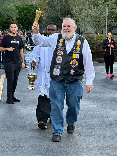 Archbishop Thomas Wenski blesses riders and their bikes before setting off on his 12th annual Motorcycle Ride, held Jan. 28, 2024, starting from Our Lady of Guadalupe Church in Doral. The ride raised around $ 17,000 for St. Luke's Substance Abuse Treatment Center, a Catholic Charities facility in Miami.