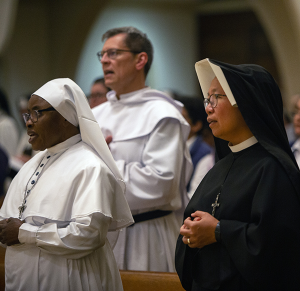Praying during the Mass for the World Day of Prayer for Consecrated Life, celebrated Feb. 3, 2024, at St. Mary Cathedral, from left: Sister M. Bernadette de Lourdes Dike of the Daughters of Mary Mother of Mercy, a jubilarian of 50 years; Trinitarian Father Kevin McGrady, ordained in October 2023; and Sister Maria Teresa of the Merciful Jesus, of the Sisters of Our Lady of Mercy, a jubilarian of 25 years.