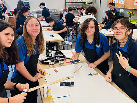 Students from Saint Anthony's Catholic School work working on the art contest at the annual Sister John Norton STEAMS Day, Feb. 24 at St. Thomas Aquinas High. From left are Mia Ravasio, Emily Rios, Sophie Valdes-Grillo and Ana Mueses.