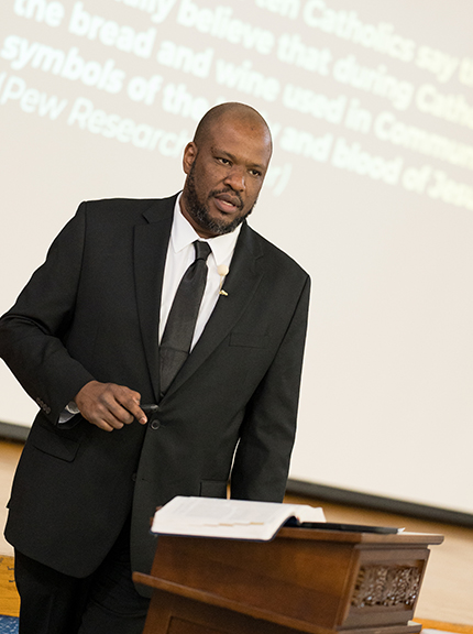 Paul Albert, a Haitian American, director of Missions for Life Teen in Northeast Georgia speaks March 16, 2024, at St. Gregory the Great Church in Plantation during a National Eucharistic Revival Summit