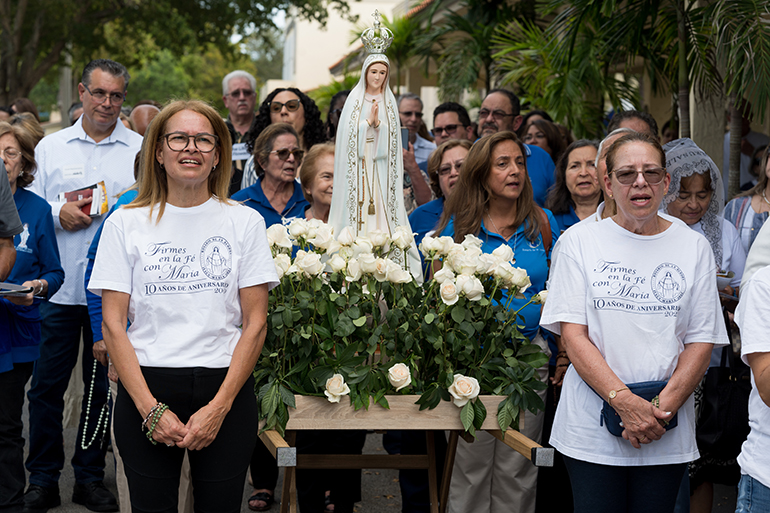 Parish representatives and others participate in an outdoor rosary pilgrimage March 16, 2024, at St. Gregory the Great Church in Plantation, during a National Eucharistic Revival Summit.