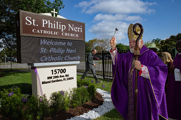 Archbishop Thomas Wenski blesses new digital sign, new pews at St. Philip Neri Church in Miami Gardens, March 17, 2024.