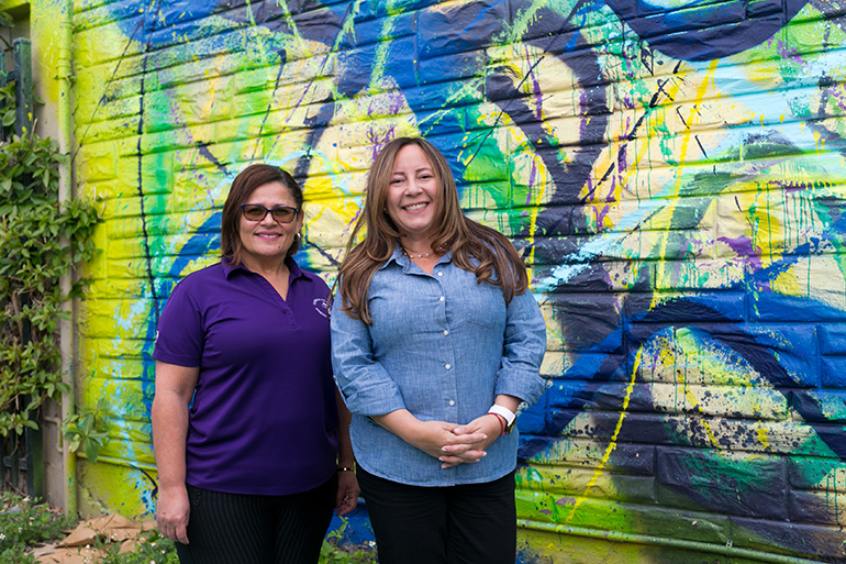 Evelyn Soto, director of New Life Family Center, a Catholic Charities emergency shelter serving homeless families in Miami-Dade County, left, with Jackie Carrion, senior director of Community Based Services for Catholic Charities of the Archdiocese of Miami, Inc.