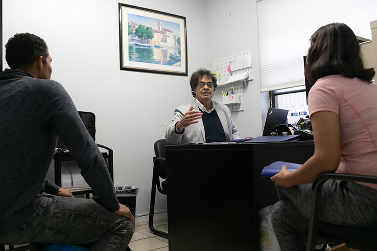 Arnaldo Soto, a Family Enrichment Specialist and case manager for New Life Family Center, a Catholic Charities emergency shelter serving homeless families in Miami-Dade County, speaks clients. The families are provided the services they need to move into permanent independent living and self-sufficiency.