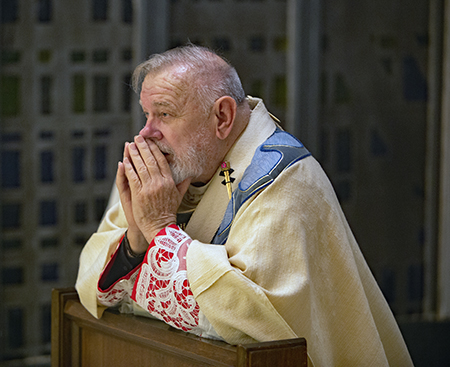 Archbishop Thomas Wenski prays before the Blessed Sacrament at the conclusion of the Mass of the Lord's Supper he celebrated on Holy Thursday, March 28, 2024, at St. Mary Cathedral, Miami.
