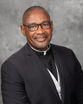 Father Robés Charles, marking 25 years of ordination in 2024.