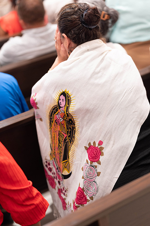 Parishioners listen to Archbishop Thomas Wenski's homily at the Mass dedicating and consecrating the new church at St. Ann's Mission in Naranja March 19, 2024.