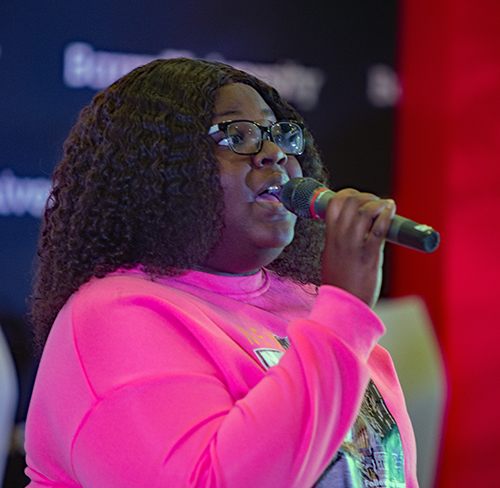 Barry University music student, Nicolette Raphael, sings a Haitian prayer, "A Lot of Rocks" before a panel discussion, March 21, 2024, at immigration conference at Barry University.