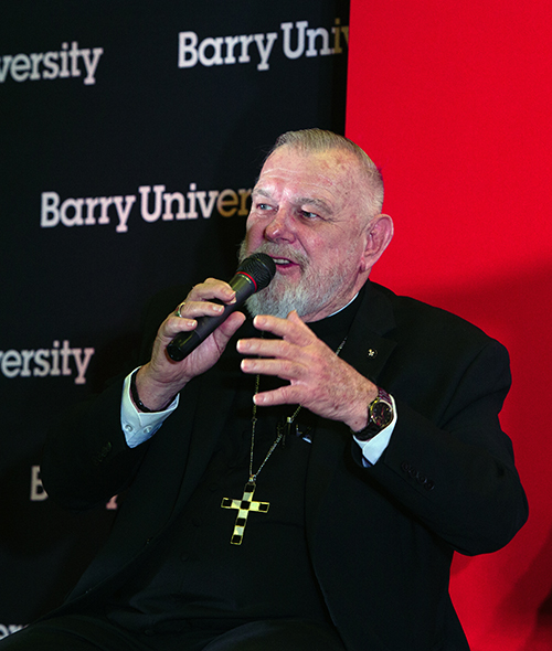 Archbishop Thomas Wenski speaks during a panel discussion at the immigration conference March 21, 2024, at Barry University.