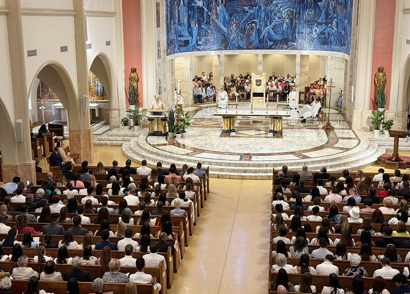 Archbishop Thomas Wenski preaches the homily during the Rite of Reception ceremony April 14, 2024, at St. Mary Cathedral.