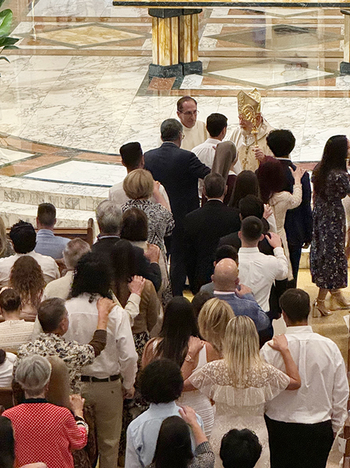 Archbishop Thomas Wenski welcomes candidates into the Church, during the Rite of Reception ceremony April 14, 2024, at St. Mary Cathedral.