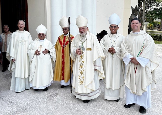 From left: Father Patrick O'Neill, former president of St. Thomas University in Miami (STU); Bishop Enrique Delgado, Auxiliary Bishop of Miami; Cardinal Juan de la Caridad García, Archbishop of Havana; Miami Archbishop Thomas Wenski; Bishop Eloy Ricardo Domínguez Martínez, Auxiliary Bishop of Havana; and Father Rafael Capo, vice president for Mission at STU, pose for a photo in front of the reconstructed chapel of the former Santo Tomás de Villanueva University in Havana, April 24, 2024.