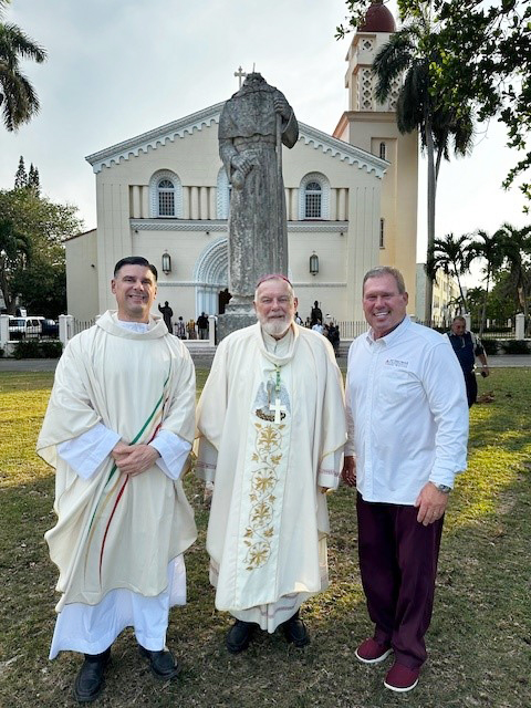 Miami Archbishop Thomas Wenski (center), Father Rafael Capo (left), vice president of Mission of St. Thomas University in Miami (STU), and David Armstrong, president of STU, pose for a photo in front of the reconstructed chapel of the former Santo Tomás de Villanueva University in Havana, Cuba, April 24, 2024.