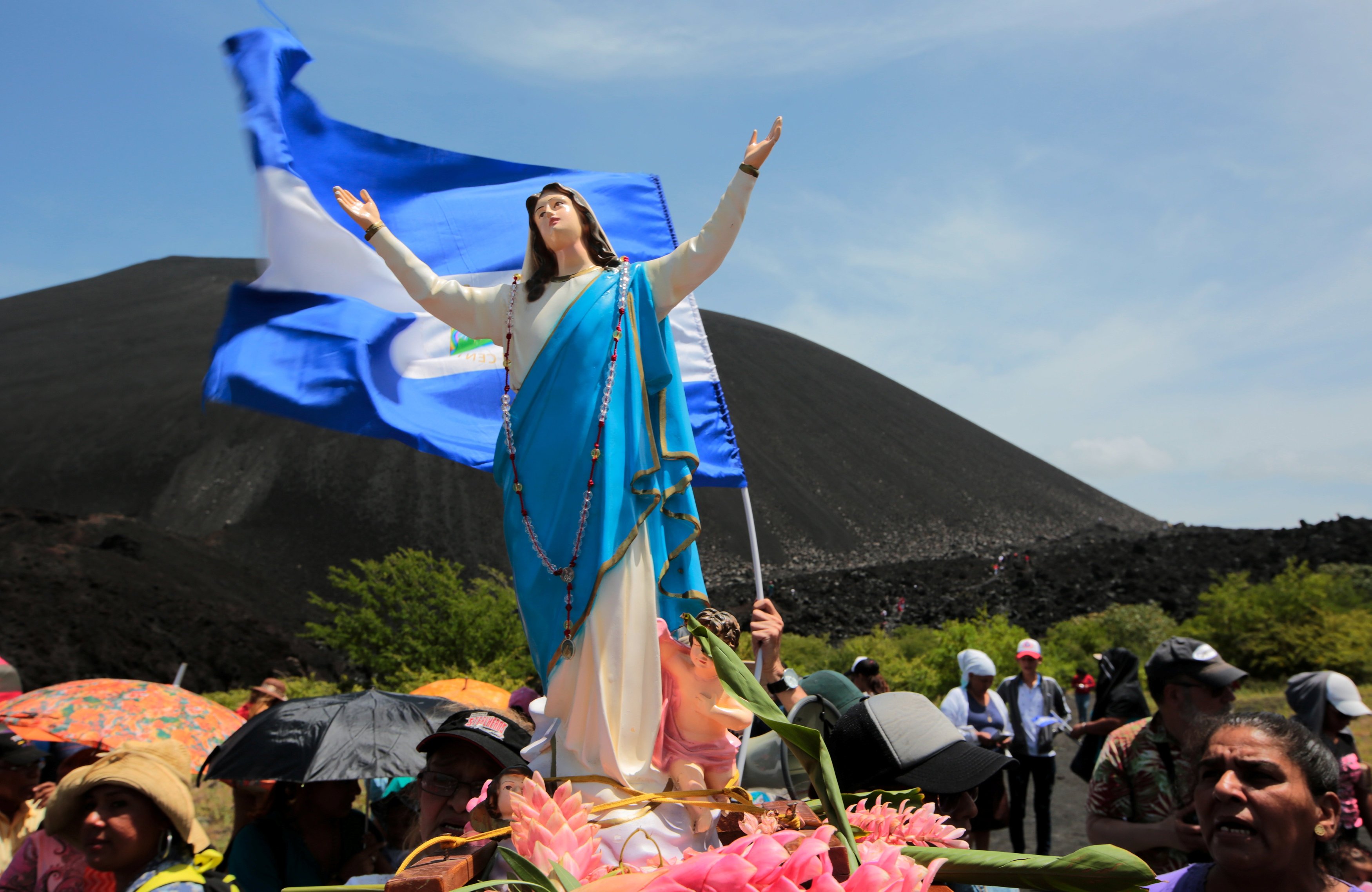 Nicaraguans carry a statue of Mary during an Aug. 14, 2018,  pilgrimage in Leon to demand an end to violence in the country. Aug. 15 is the feast of the Assumption of Mary. For several years now, the regime of President Daniel Ortega and his wife, Vice President Rosario Murillo, have branded priests and bishops as "terrorists" and "coup mongers," while curtailing public demonstrations of faith — such as processions and patron saint celebrations.(CNS photo/Oswaldo Rivas, Reuters)