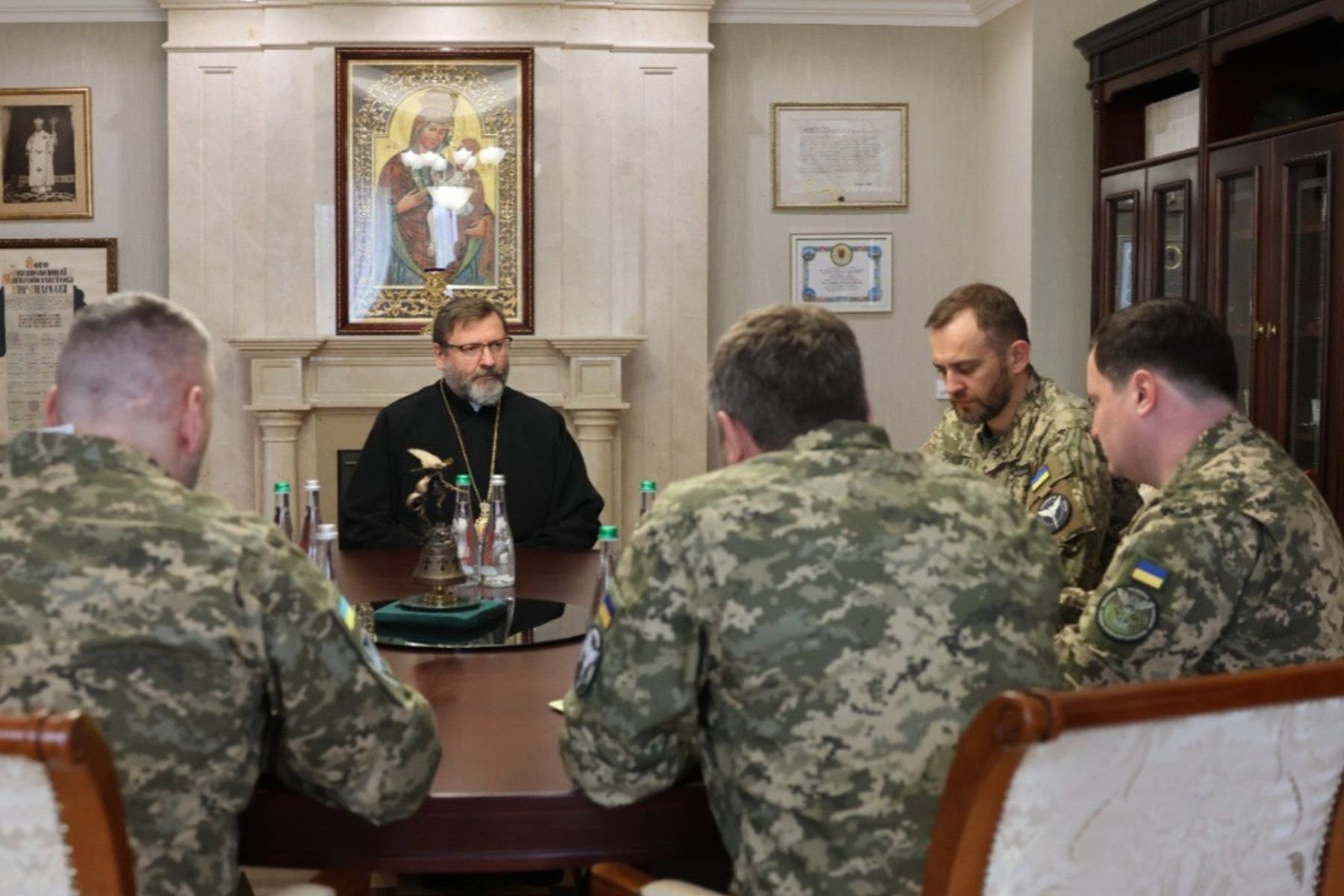 Major Archbishop Sviatoslav Shevchuk of Kyiv-Halych, head of the worldwide Ukrainian Greek Catholic Church, is seen in an April 2024 photograph with members of the Ukrainian military at the Patriarchal Cathedral complex in Kyiv. The major archbishop and the Ukrainian military officials discussed a range of issues, including Russia's detention of two Ukrainian Catholic priests whose fate remains unknown. (OSV News photo/courtesy UGCC)