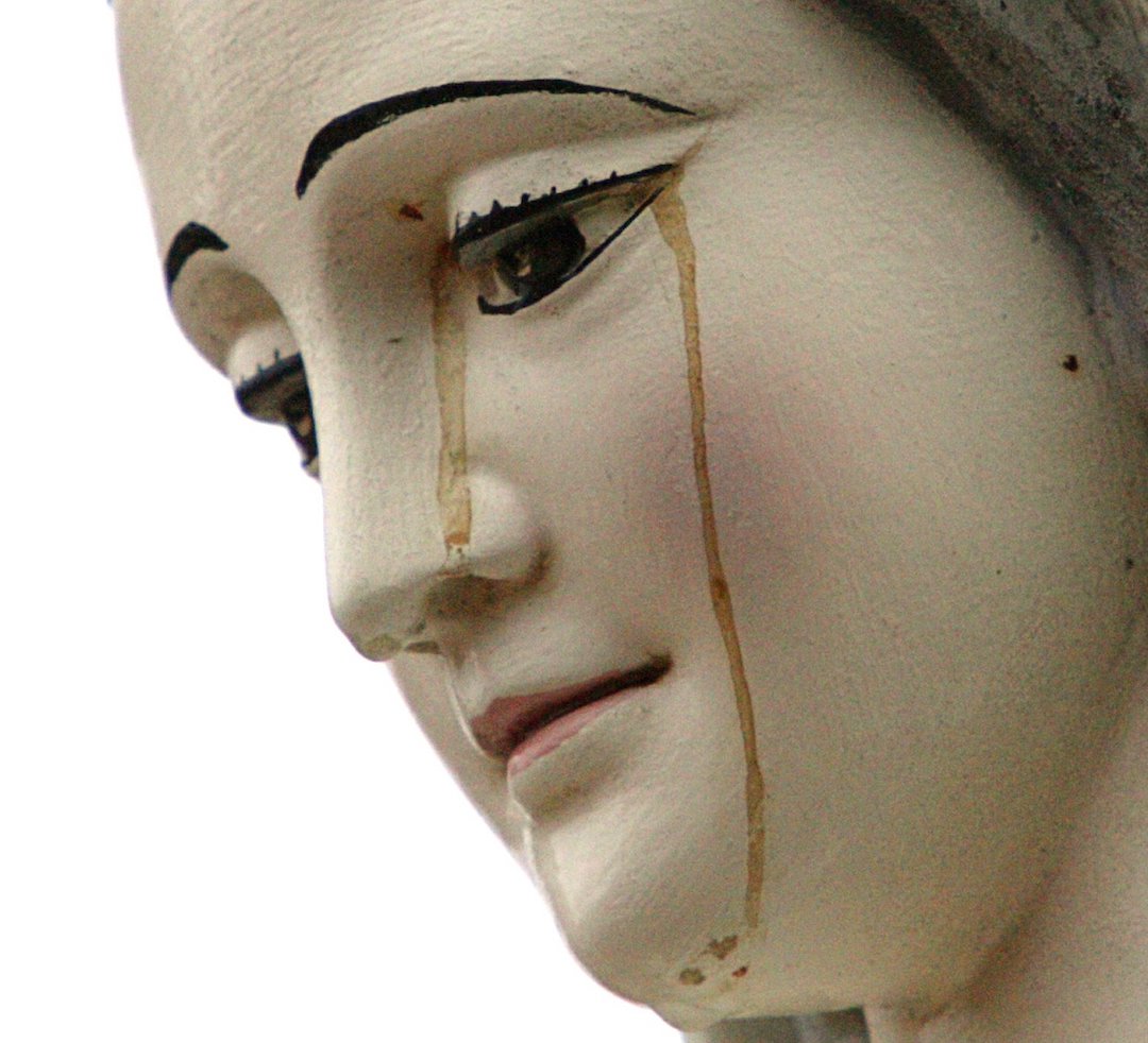 A red substance, that believers say is blood, drips from the eyes of a statue of the Virgin Mary on the outskirts of Sacramento, California, Dec. 1, 2005. (OSV News photo/Kimberly White, Reuters)