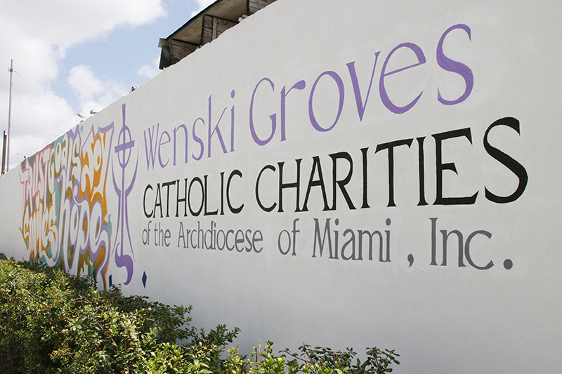The mural for Wenski Groves, created by artist Erni Vales, features words like 'Hope' and 'Joy' to inspire residents of the affordable housing complex run by Catholic Charities. Wenski Groves includes 30 apartments, 20 efficiencies, and 10 single-bedroom spaces, and was blessed April 26, 2024.