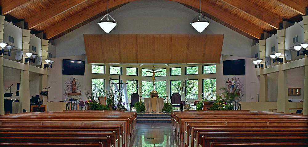 Big windows behind the chancel allow members of Mary Help of Christians Church in Parkland to enjoy nature even during Mass.