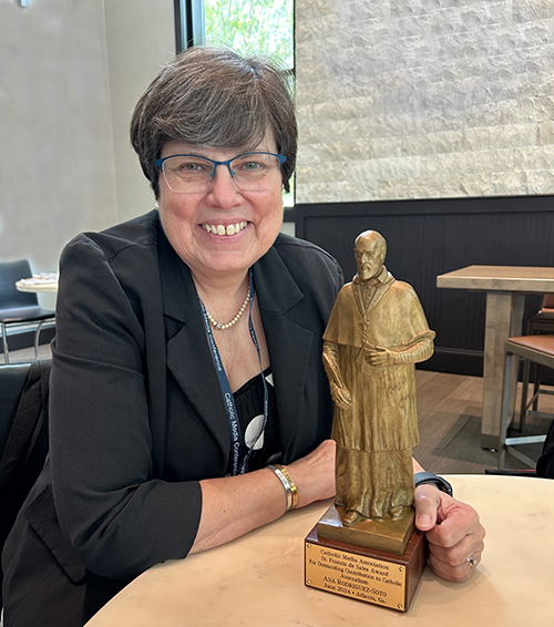 Ana Rodriguez-Soto, recently retired editor of the Florida Catholic, Miami edition, posed with the St. Francis de Sales Award after receiving it during the Catholic Media Conference in Atlanta on June 21, 2024.