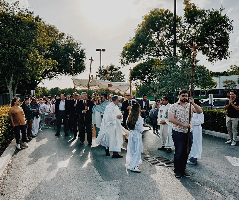 The faithful participate in a Eucharistic procession during the solemnity of Corpus Christi June 3, 2024, around the perimeter of St. Mark Parish in Southwest Ranches.