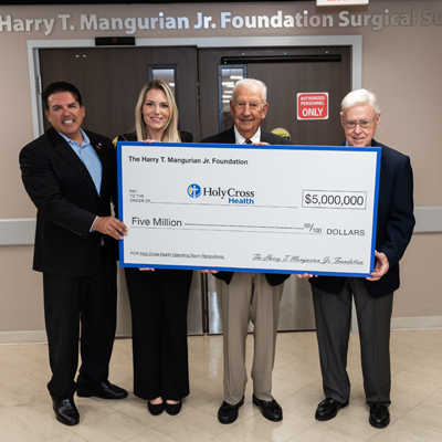 The Harry T. Mangurian Jr. Foundation donated million to Holy Cross Health in Fort Lauderdale, which helped renovate the surgical suites of the hospital, now named after the donor. From left to right in the photo are Mark Doyle, president and CEO of Holy Cross Health, and Laura Denoux, vice president and Chief Development Officer, joined by Steve Mehallis, president of The Harry T. Mangurian Jr. Foundation and Gordon Latz, vice president.