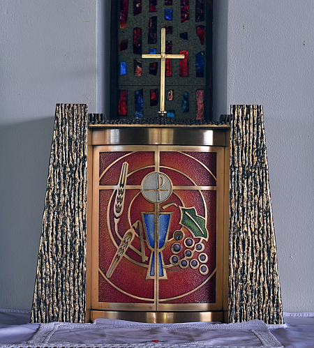 Wheat and grapes surround a chalice and Host on the front doors of the Tabernacle at St. Paul Church in Lighthouse Point. The Tabernacle is used to store the consecrated Host.