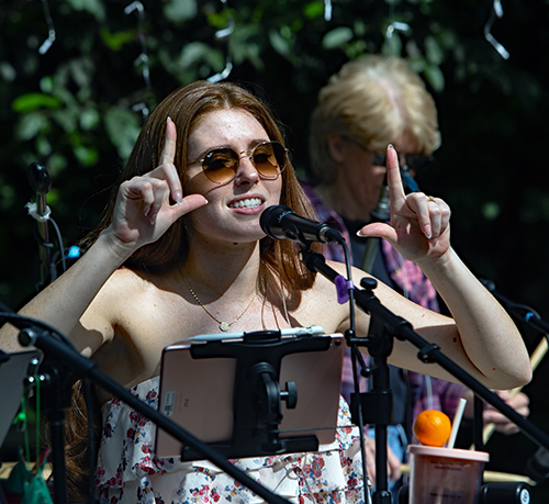 Jackie Rodriguez, a members of G-dsquad — an all female Christian contemporary band for church events — sings and gestures during practice session.