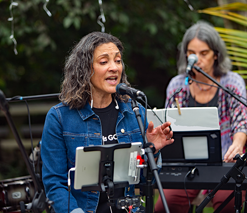 Ada Sheerin. a member and leader of G-dsquad — an all female Christian contemporary band for church events — sings during a practice session.