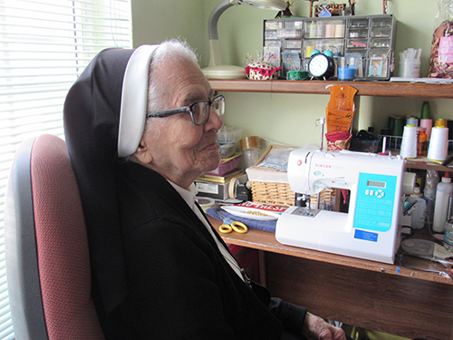 Sr. Anunciata Fernandez, 96, with her sewing machine, helping the sick and doing handicrafts. A member of the Oblate Sisters of Divine Providence in Miami Beach, Sister Anunciata is celebrating 75 years of religious life that began in her native Cuba.