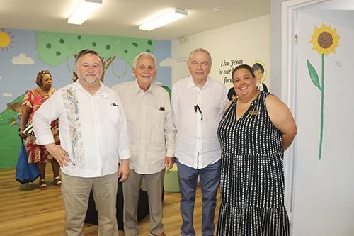 From left, Francisco Flores, visitor of the Antilles Mexico South District of the De La Salle Brothers; former students of the La Salle school in Cuba Jorge Pino and Eduardo Obreño; and Monica Lauzurique, administrative coordinator of the new school ‘Little School,' pose for a photo inside the facilities of the educational center, after the blessing Mass by Archbishop Thomas Wenski, on August 18, 2024.