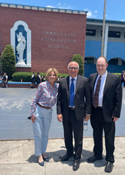 Principal Victoria Leon poses with City of Hialeah Mayor Esteban Bovo, Jr., and Superintendent of Catholic Schools Jim Rigg.
